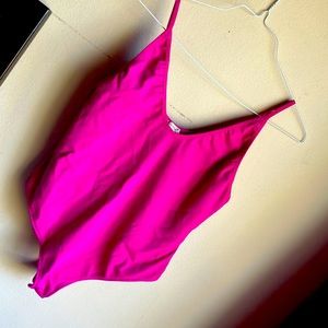 Bodysuit purple. Doesn’t have the size but I think it’ll fit small.